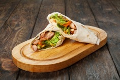 gallery/burrito-with-chicken-and-vegetable-at-wooden-desk-p32egak